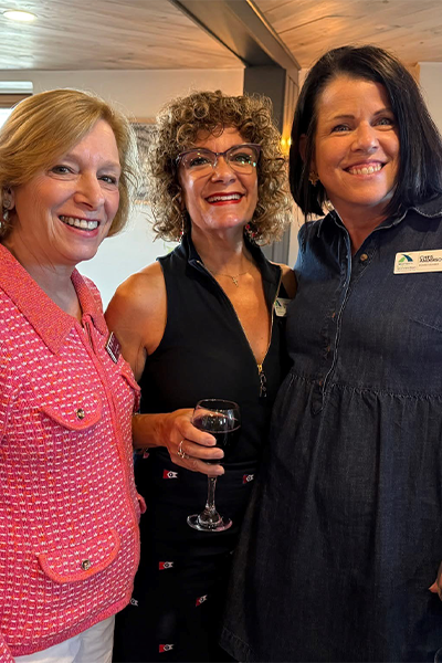 Woman smiling and happy together at networking event